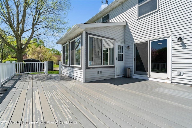 wooden terrace with a sunroom