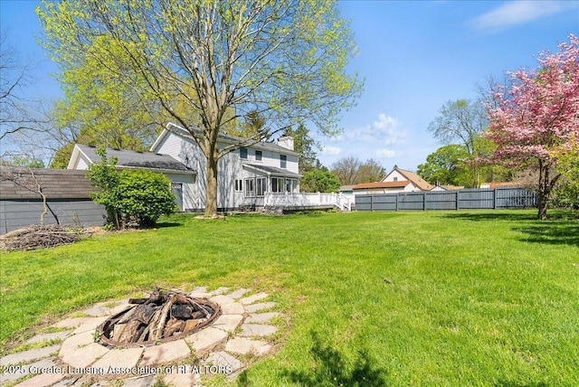 view of yard with an outdoor fire pit