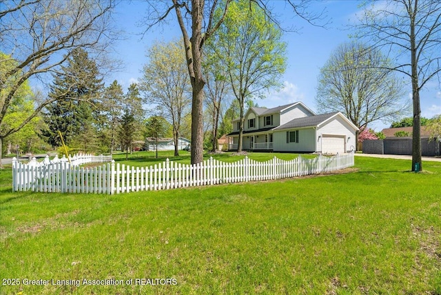 view of side of property with an attached garage and driveway
