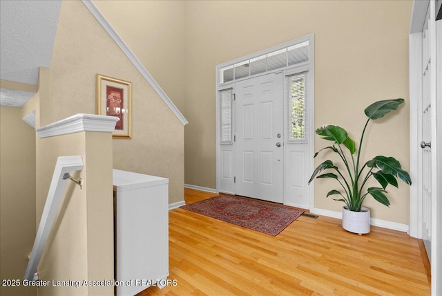 3837 Plover Pl, East Lansing, MI 48823 - entrance foyer with wood finished floors and baseboards