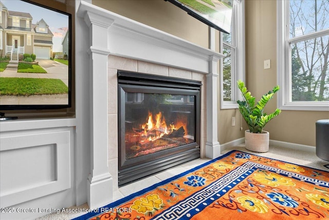 3837 Plover Pl, East Lansing, MI 48823 - detailed view of a tiled fireplace and baseboards
