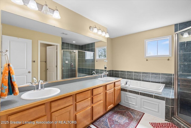 3837 Plover Pl, East Lansing, MI 48823 - bathroom with a stall shower, a garden tub, and double vanity