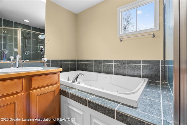 3837 Plover Pl, East Lansing, MI 48823 - bathroom featuring a stall shower, vanity, and a tub with jets