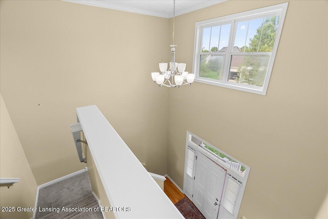 3837 Plover Pl, East Lansing, MI 48823 - stairway featuring a chandelier, crown molding, and baseboards