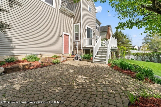 3837 Plover Pl, East Lansing, MI 48823 - view of patio / terrace with a wooden deck and stairs