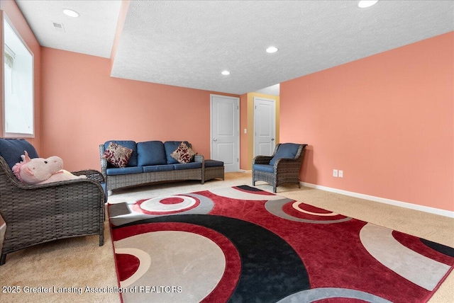 3837 Plover Pl, East Lansing, MI 48823 - carpeted living area with recessed lighting, baseboards, and a textured ceiling