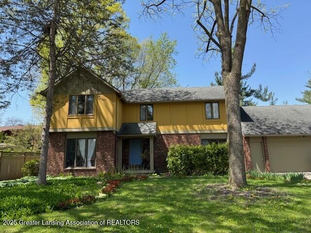 1785 Bramble Dr, East Lansing, MI 48823 - view of front of home with brick siding