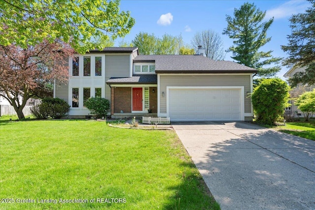1263 Leeward Dr, Okemos, MI 48864 - view of front of property featuring concrete driveway, a garage, a front yard, and a chimney