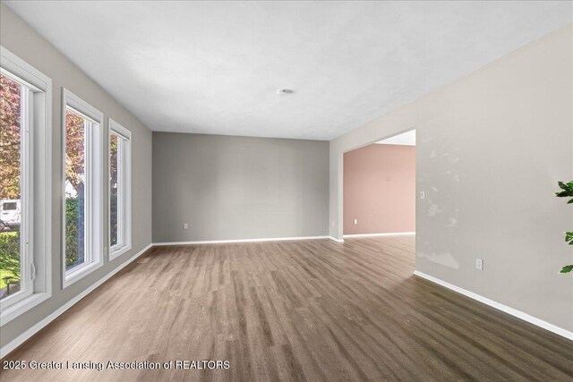 1263 Leeward Dr, Okemos, MI 48864 - unfurnished room with baseboards and wood finished floors