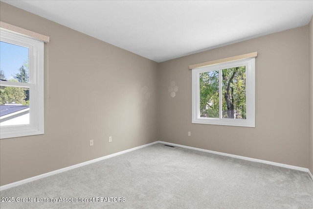 1263 Leeward Dr, Okemos, MI 48864 - carpeted spare room featuring baseboards
