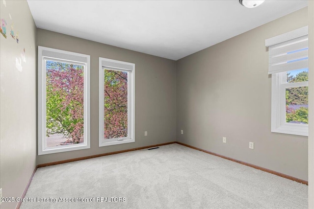 1263 Leeward Dr, Okemos, MI 48864 - carpeted empty room with baseboards