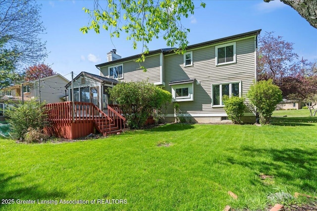 1263 Leeward Dr, Okemos, MI 48864 - back of house with a sunroom, a chimney, a lawn, and stairs