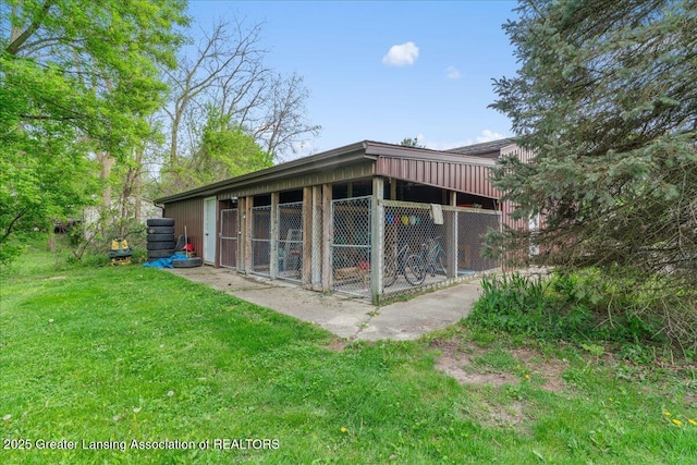 10111 Kinneville Rd, Eaton Rapids, MI 48827 - rear view of property with an outbuilding and an exterior structure