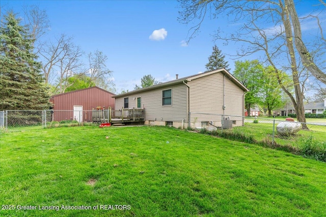 10111 Kinneville Rd, Eaton Rapids, MI 48827 - rear view of property featuring a wooden deck and central AC unit