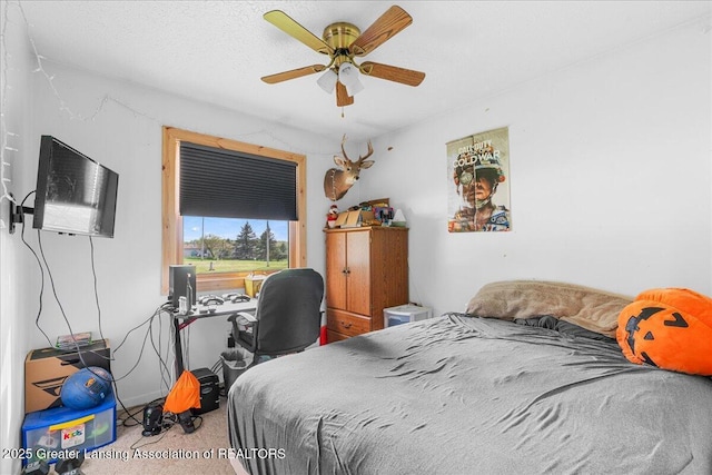 10111 Kinneville Rd, Eaton Rapids, MI 48827 - carpeted bedroom with a ceiling fan