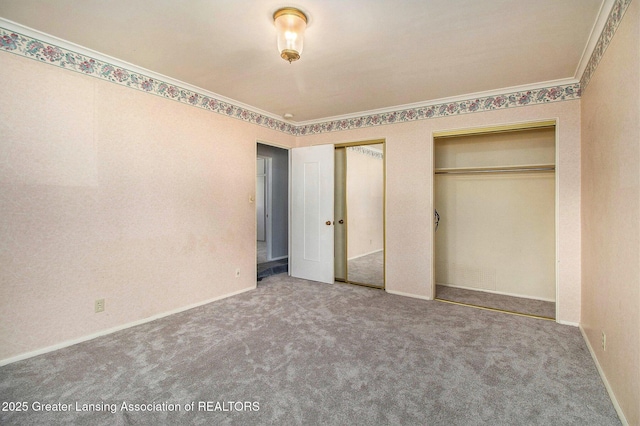 160 Lincoln Hill Dr, Battle Creek, MI 49015 - unfurnished bedroom featuring two closets, crown molding, carpet, and baseboards