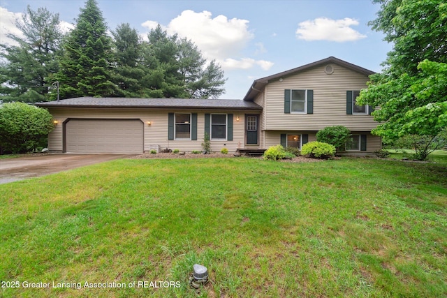 5080 Cornell Rd, Okemos, MI 48864 - split level home featuring an attached garage, concrete driveway, and a front yard