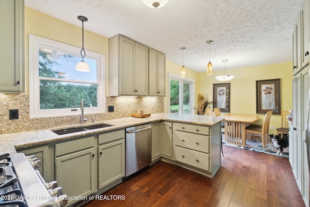 5080 Cornell Rd, Okemos, MI 48864 - kitchen featuring dishwasher, a sink, a peninsula, dark wood finished floors, and backsplash
