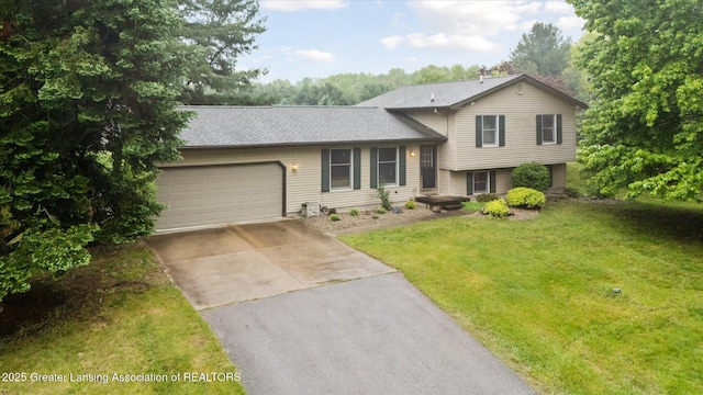 5080 Cornell Rd, Okemos, MI 48864 - tri-level home with concrete driveway, an attached garage, and a front lawn