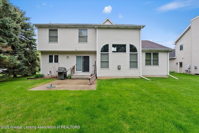 13503 Cottonwood Ct, Dewitt, MI 48820 - back of house featuring a patio area and a lawn