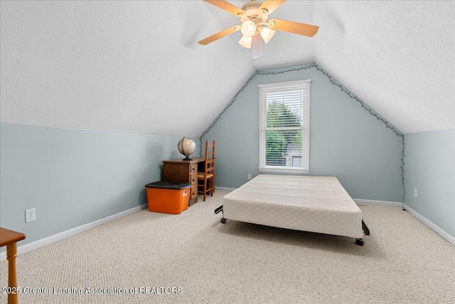13503 Cottonwood Ct, Dewitt, MI 48820 - carpeted bedroom featuring a textured ceiling, baseboards, lofted ceiling, and ceiling fan