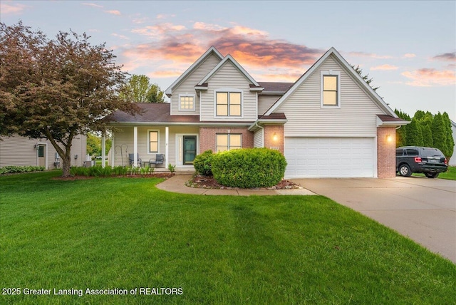 13503 Cottonwood Ct, Dewitt, MI 48820 - traditional home featuring an attached garage, driveway, a front lawn, and brick siding