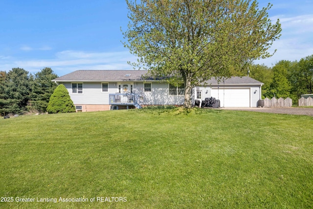 2335 N Concord Rd, Albion, MI 49224 - view of front of house featuring dirt driveway, a front yard, and an attached garage