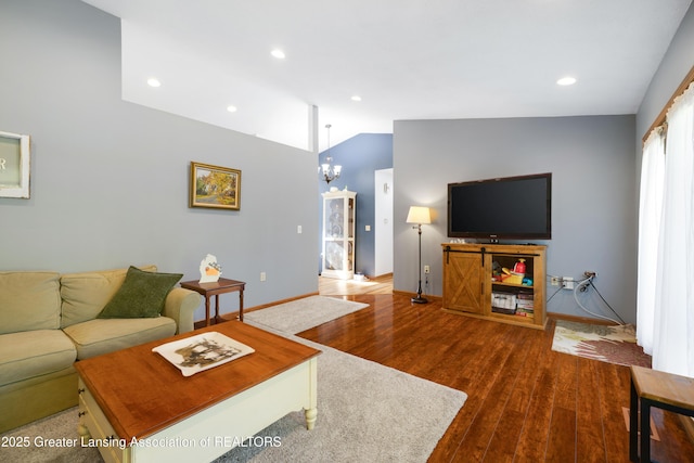 2335 N Concord Rd, Albion, MI 49224 - living room featuring baseboards, vaulted ceiling, wood finished floors, a chandelier, and recessed lighting