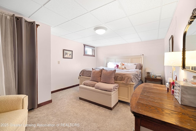 2335 N Concord Rd, Albion, MI 49224 - bedroom with light colored carpet, a drop ceiling, and baseboards