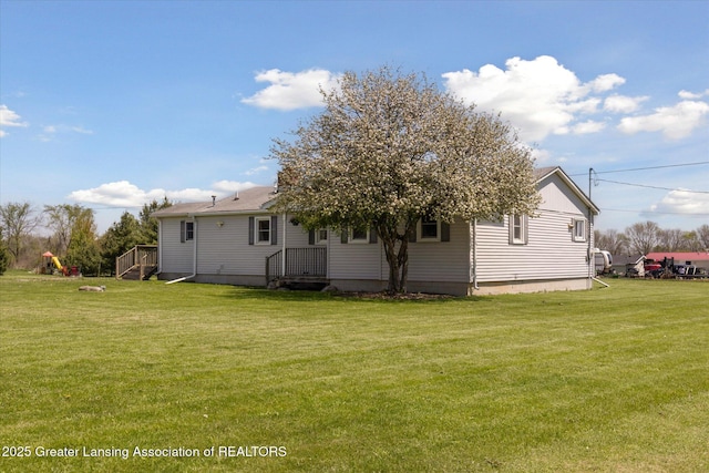 13321 Russell Rd, Lake Odessa, MI 48849 - rear view of property with a yard