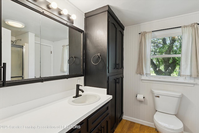 13321 Russell Rd, Lake Odessa, MI 48849 - bathroom featuring baseboards, wood finished floors, toilet, and vanity