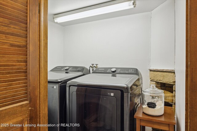 13321 Russell Rd, Lake Odessa, MI 48849 - clothes washing area featuring washing machine and clothes dryer