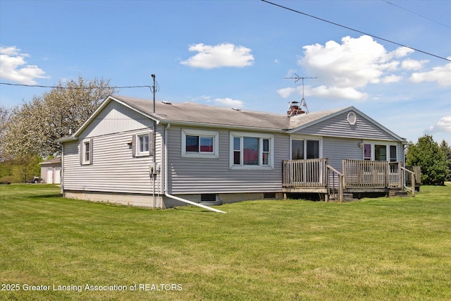 13321 Russell Rd, Lake Odessa, MI 48849 - rear view of property featuring a yard, a wooden deck, and a chimney