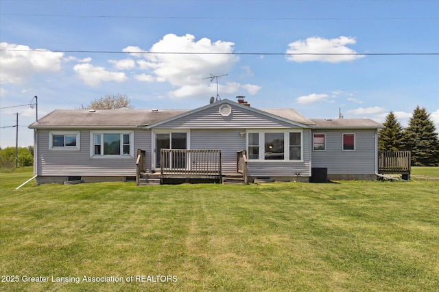 13321 Russell Rd, Lake Odessa, MI 48849 - rear view of property featuring a deck, central AC, and a lawn