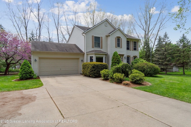 traditional-style house featuring an attached garage, concrete driveway, and a front yard