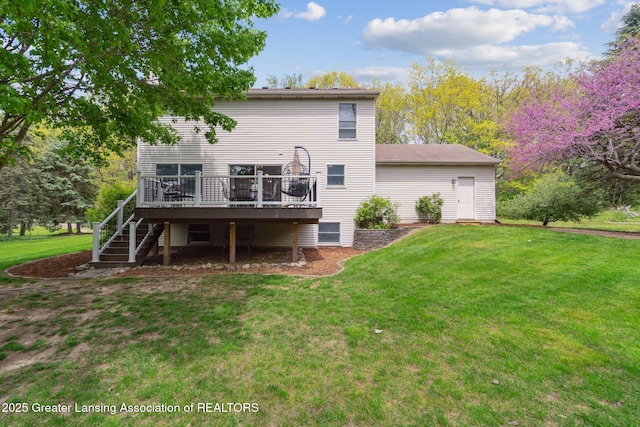 back of property featuring a deck, stairway, and a yard