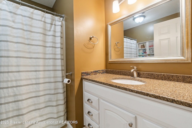 bathroom with vanity and a shower with shower curtain