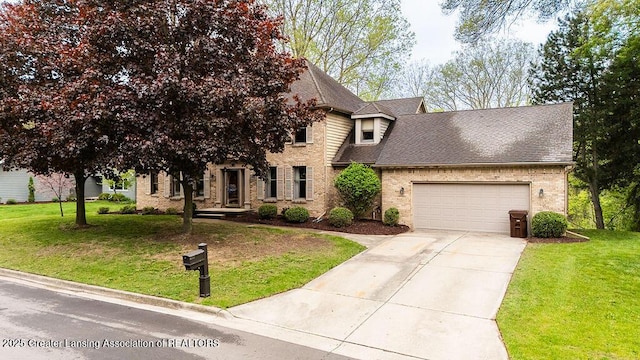 4245 Sandridge Dr, Okemos, MI 48864 - view of front of home with an attached garage, concrete driveway, roof with shingles, and a front lawn