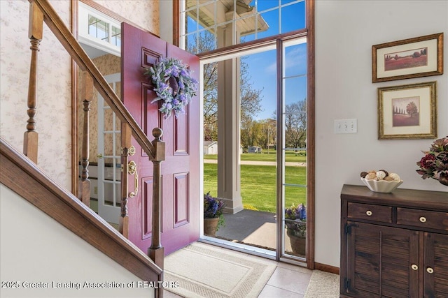 1801 Tahyio Rd, Owosso, MI 48867 - tiled foyer entrance featuring stairway and baseboards