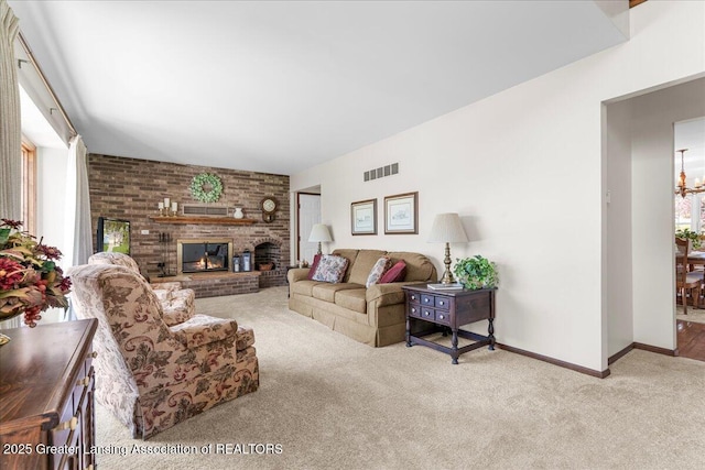 1801 Tahyio Rd, Owosso, MI 48867 - carpeted living area with a brick fireplace, a chandelier, and baseboards