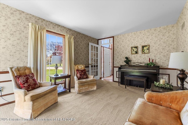 1801 Tahyio Rd, Owosso, MI 48867 - living area with wallpapered walls and carpet flooring