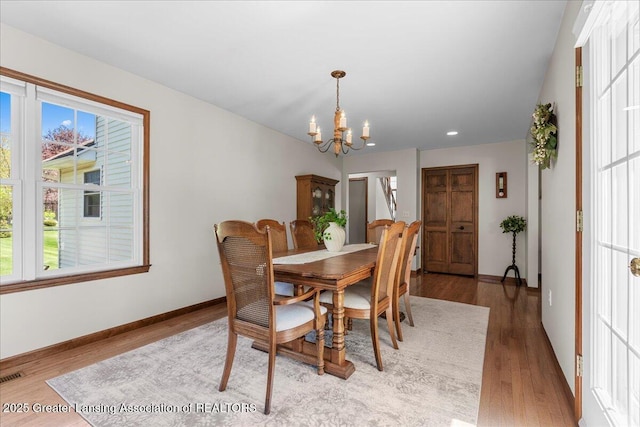1801 Tahyio Rd, Owosso, MI 48867 - dining room with a chandelier, healthy amount of natural light, wood finished floors, baseboards, and recessed lighting