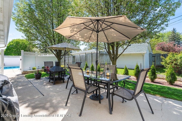 1801 Tahyio Rd, Owosso, MI 48867 - view of patio / terrace with outdoor dining area and a fenced backyard