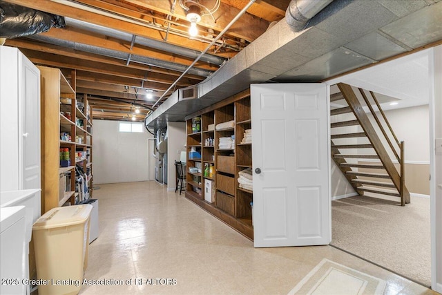 1801 Tahyio Rd, Owosso, MI 48867 - below grade area featuring separate washer and dryer and stairs