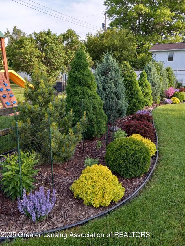 1801 Tahyio Rd, Owosso, MI 48867 - view of grassy yard with a playground