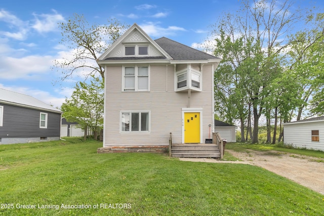 114 Haze St, Lansing, MI 48917 - view of front of home featuring a front yard and an outdoor structure