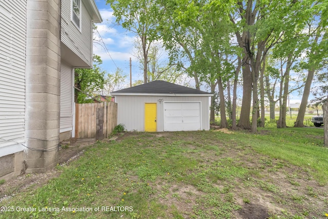 114 Haze St, Lansing, MI 48917 - view of yard with a garage, an outbuilding, and fence