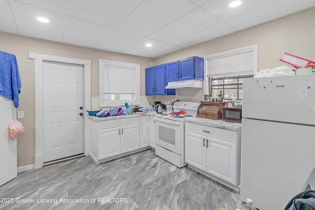 114 Haze St, Lansing, MI 48917 - kitchen with white appliances, under cabinet range hood, light countertops, white cabinetry, and recessed lighting