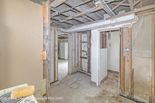114 Haze St, Lansing, MI 48917 - unfinished basement with freestanding refrigerator