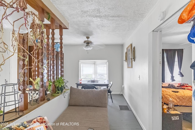 114 Haze St, Lansing, MI 48917 - corridor with a textured ceiling and baseboards
